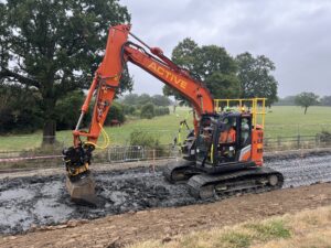 Excavator working with clay